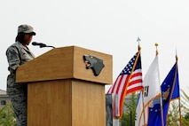 U.S. Air Force Chief Master Sgt. Nicole Wilson, 607th Support Squadron superintendent speaks during the 9/11 Remembrance Ceremony at Kunsan Air Base, Republic of Korea, Sept. 12, 2016. In 2001, Wilson was stationed at Boling Air Force Base, Washington, D.C. and volunteered to be a part of a team that removed classified documents from burn sites at the Pentagon after the attacks took place. (U.S. Air Force photo by Senior Airman Ashley L. Gardner/Released)
