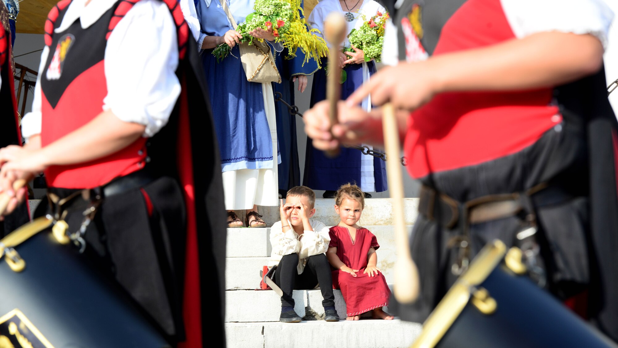 Italian children watch a medieval parade reenactment during the 15th Annual Italian-American Friendship Festival in Spilimbergo, Italy on Sept. 10, 2016. The festival included a sports tournament, mosaic school tour, military vehicle and aircraft static displays, parade, and 9/11 memorial ceremony. (U.S. Air Force photo by Tech. Sgt. R.J. Biermann/Released)
