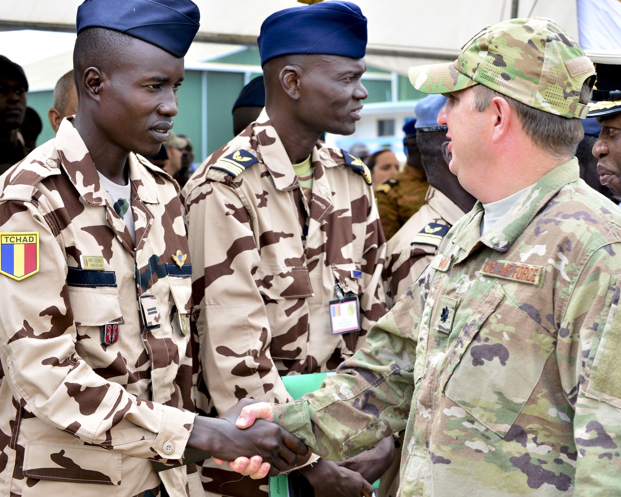 U.S. Air Force Lt. Col Brady Vaira, right, 435th Contingency Response Group deputy commander, meets with airman from Chad following African Partnership Flight opening ceremony Sept. 12, 2016. Twelve African counties are participating in AFP Ghana with the common goal of increasing regional capabilities while building relationships throughout West Africa. (U.S. Air Force photo by Staff Sgt. Stephanie Longoria) 