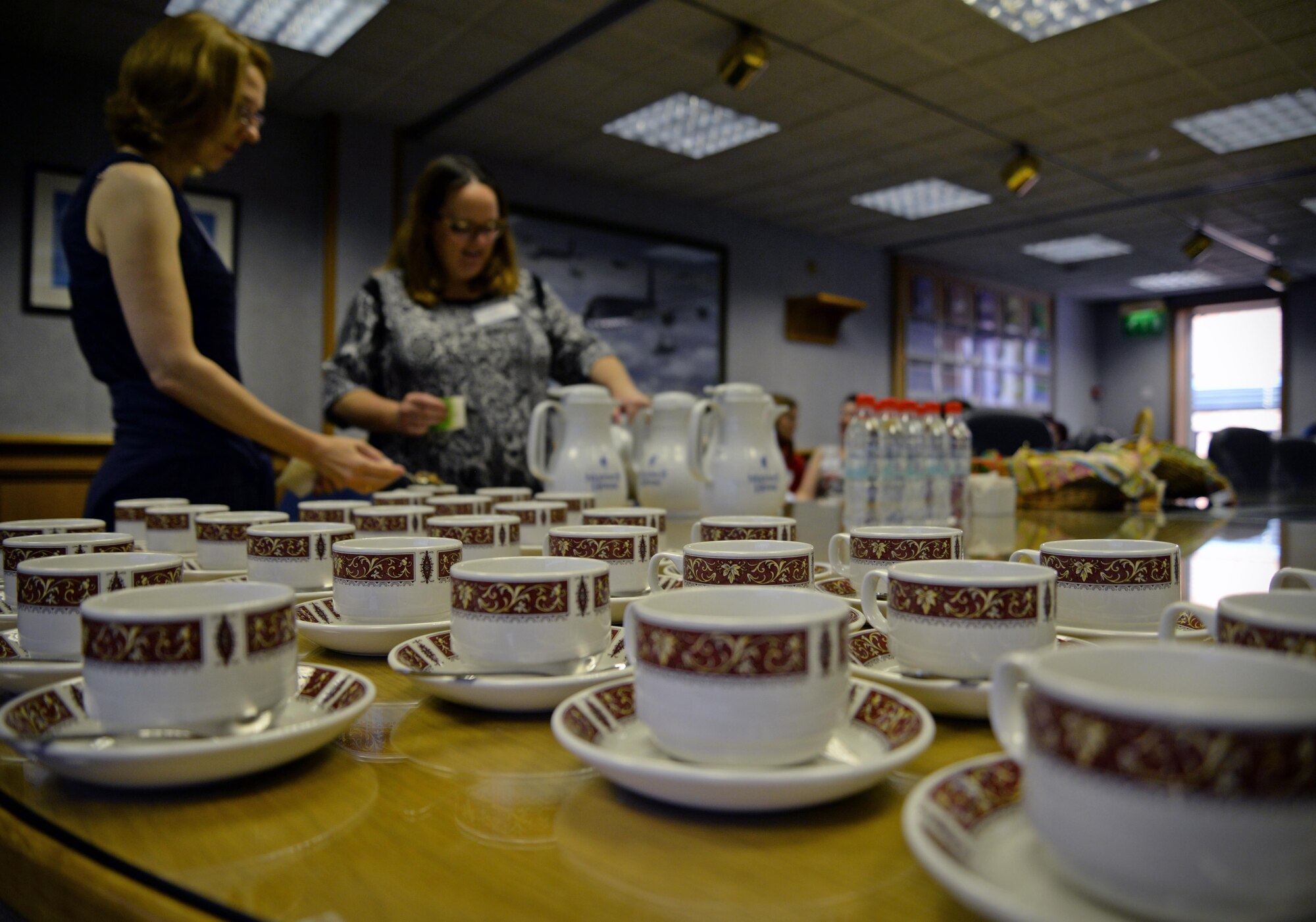 Spouses of U.S. Air Force members were treated to tea and scones in the 100th Air Refueling Wing conference room Sept. 8, 2016, on RAF Mildenhall, England. The Spouse Immersion Tour gave Team Mildenhall spouses an opportunity to network and gain a better understanding of programs and facilities on base.  (U.S. Air Force photo by Senior Airman Christine Christine Halan)