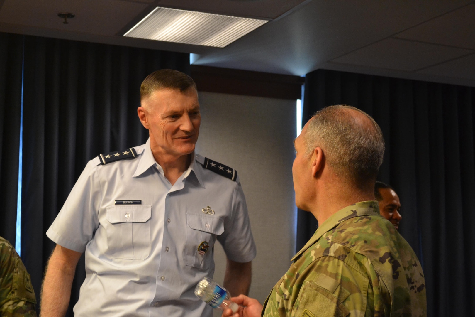 Air Force Lt. Gen. Andy Busch and Army Lt. Gen. Gustave Perna converse during a break at the Army/DLA Day, Sept. 8 at the Pentagon.