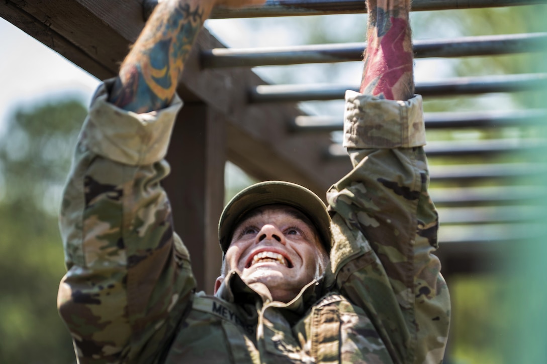 Army Staff Sgt. Jacob Meyers negotiates the monkey bars during the Army Reserve Drill Sergeant of the Year competition at Fort Jackson, S.C., Sept. 8, 2016. Myers is assigned to Fort Huachuca, Ariz. Army photo by Sgt. 1st Class Brian Hamilton 