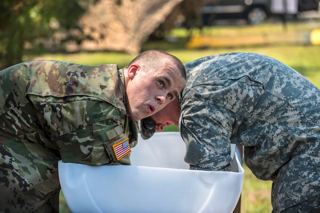 Soldiers attending basic combat training take an opportunity to cool off in the immersion cooler during the Army Reserve Drill Sergeant of the Year competition at Fort Jackson, S.C., Sept. 8, 2016. Army photo by Sgt. 1st Class Brian Hamilton