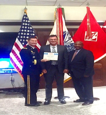 U.S. Army Corps Engineers Deputy Commanding Major General Donald E. (Ed) Jackson and Senior Executive Service member Theodore A. (Tab) Brown awards Michael Malsom with USACE Planning Associates Program certificate of completion in Washington on Aug. 30.  