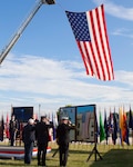 Retired Navy Capt. Chris McKelvey, the commander of the Susquehanna installation during the Sept. 11, 2001 attack, Doug Schraeder, Defense Distribution Center Susquehanna police chief, and Henry Hoffman Defense Distribution Center Susquehanna fire chief, dedicate a wreath in honor of the heroes who have perished protecting and serving the country.