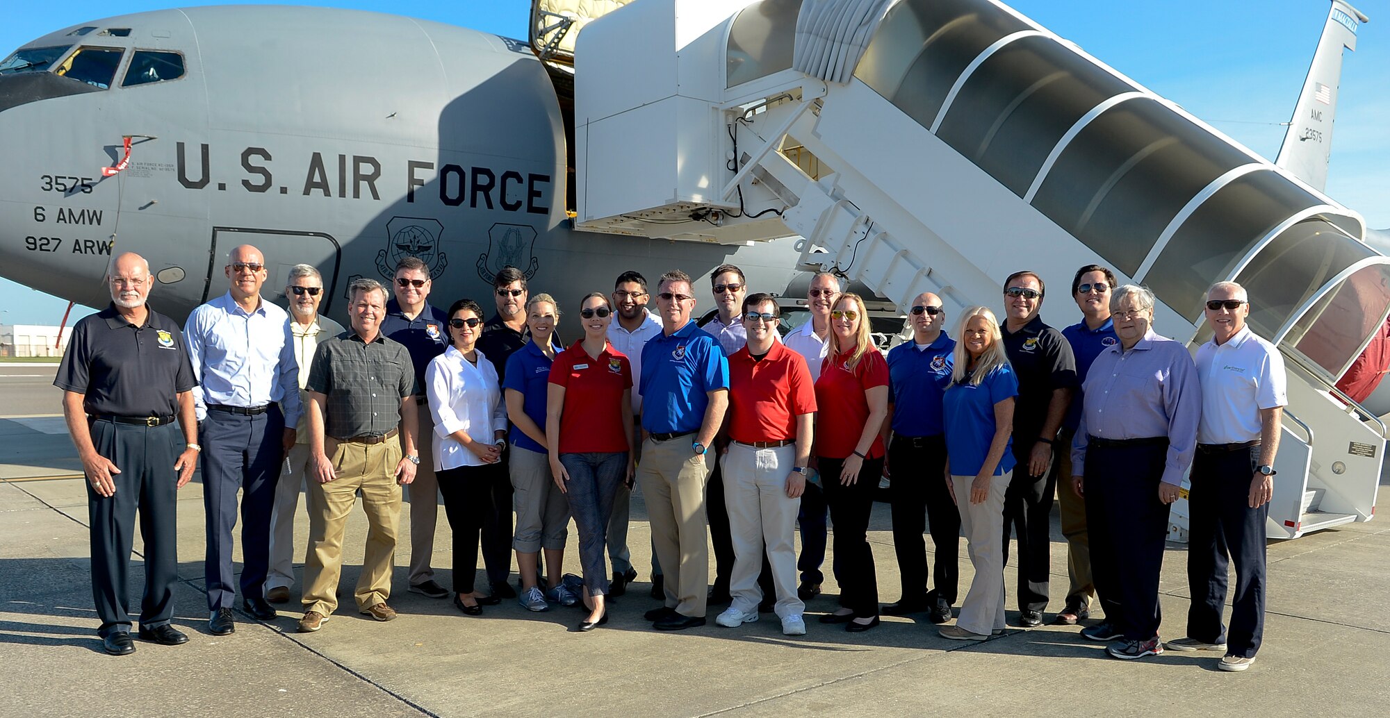 Honorary commanders pause for a group photo during the 6th Operations Group immersion, Sept. 9, 2016, at MacDill Air Force Base, Fla. Twenty-one honorary commanders visited the 927th Aeromedical Evacuation Squadron, 6th Operations Support Squadron survival specialists, and the air traffic control tower. (U.S. Air Force photo by Senior Airman Jenay Randolph)