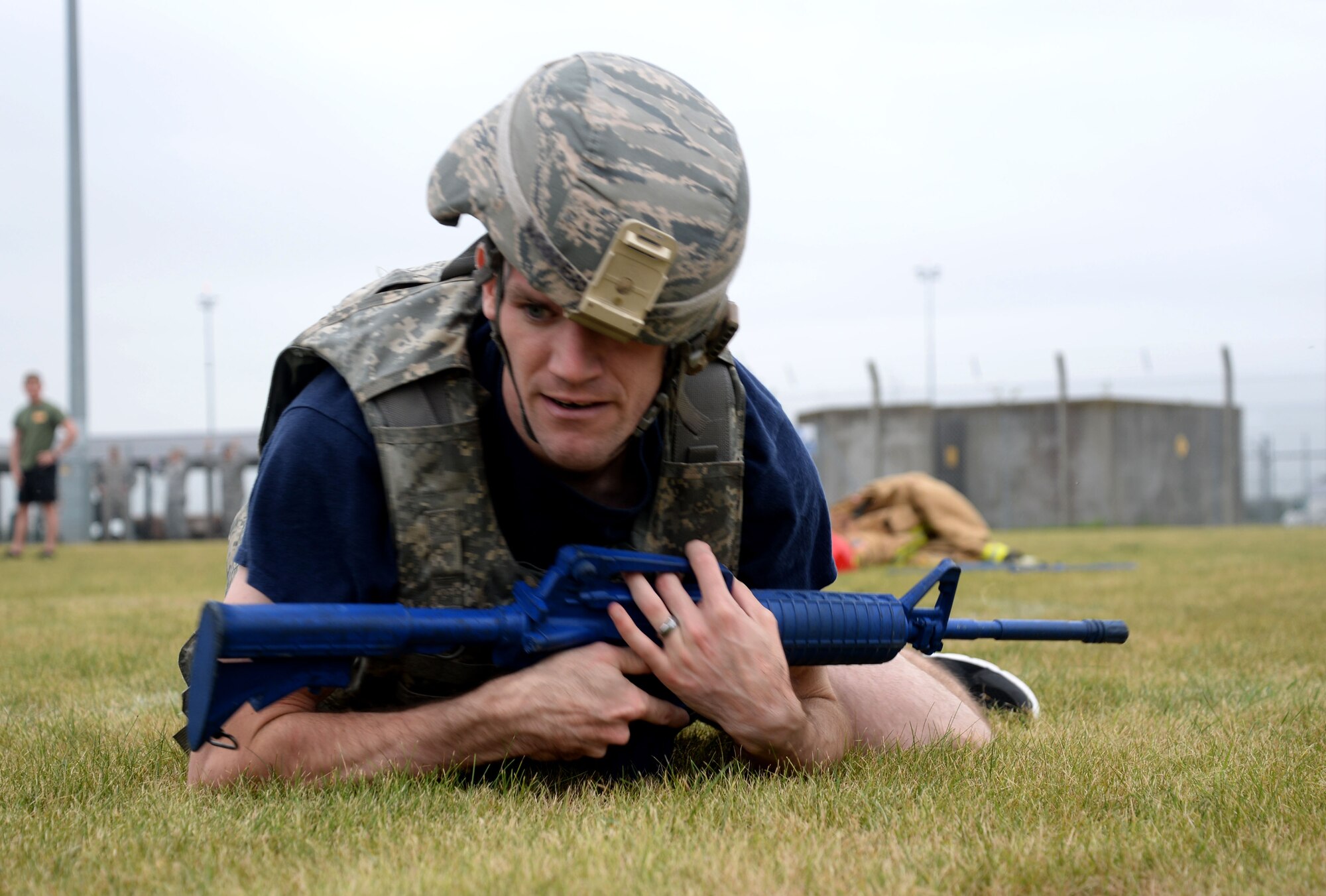 U.S. Air Force Staff Sgt. David Jeghers, 100th Civil Engineer Squadron Fire Department crew chief, performs low crawls after donning battle rattle Sept. 7, 2016, on RAF Mildenhall, England. Firefighters and defenders from the 48th CES and 48th Security Forces Squadron from RAF Lakenheath, compete in teamwork challenges with their counterparts from RAF Mildenhall’s 100th CES and 100th SFS. The Battle of the Badges competition highlights the camaraderie between the career fields and pays homage to the first responders who lost their lives on 9/11. (U.S. Air Force photo by Senior Airman Justine Rho)