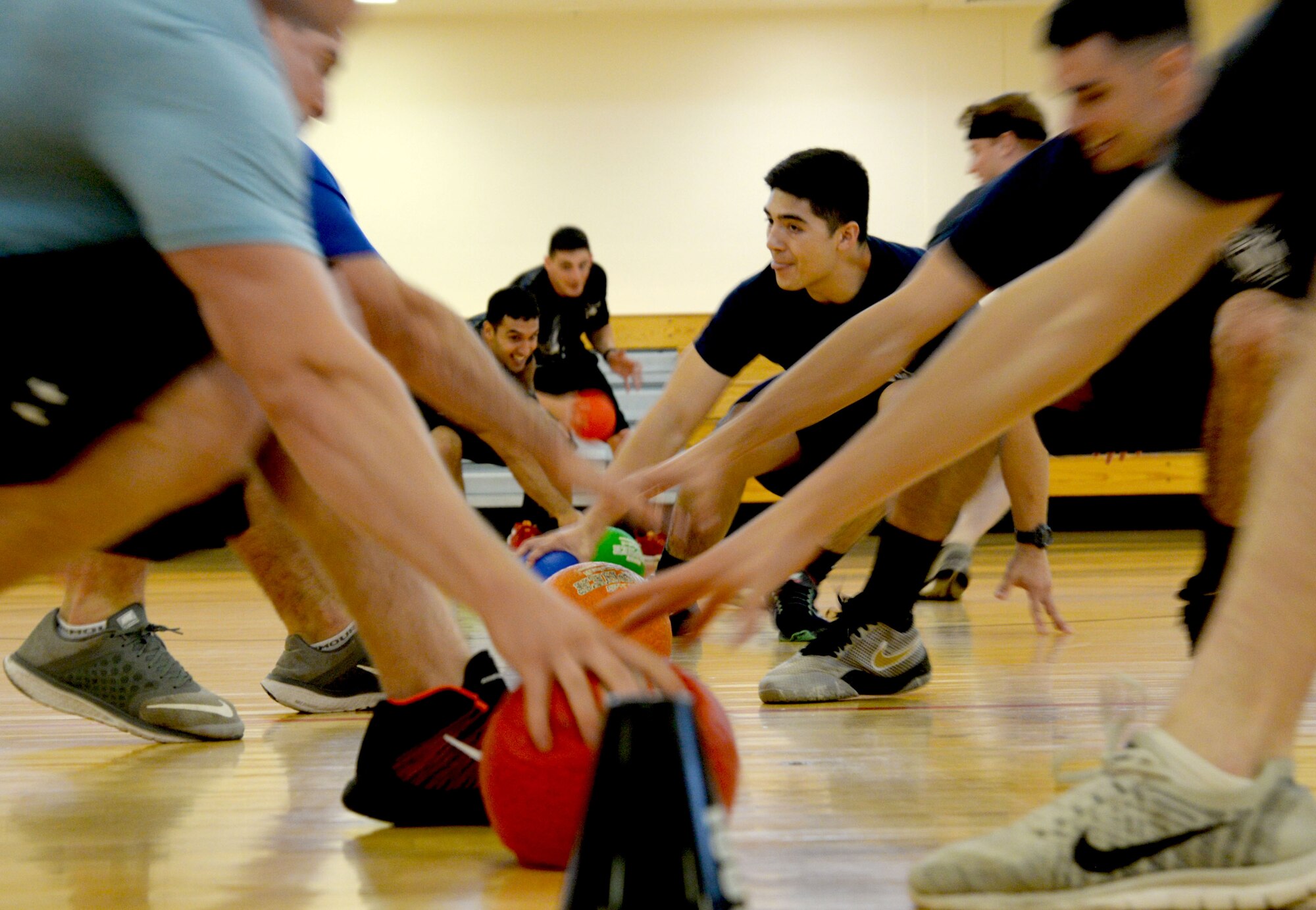 U.S. Air Force Firefighters and defenders from the 48th Civil Engineer Squadron and the 48th Security Forces Squadron from RAF Lakenheath, play dodgeball against their counterparts from the 100th CES and the 100th SFS Sept. 7, 2016, on RAF Mildenhall, England. The Battle of the Badges competition highlights the camaraderie between the career fields and pays homage to the first responders who lost their lives on 9/11. (U.S. Air Force photo by Senior Airman Justine Rho)