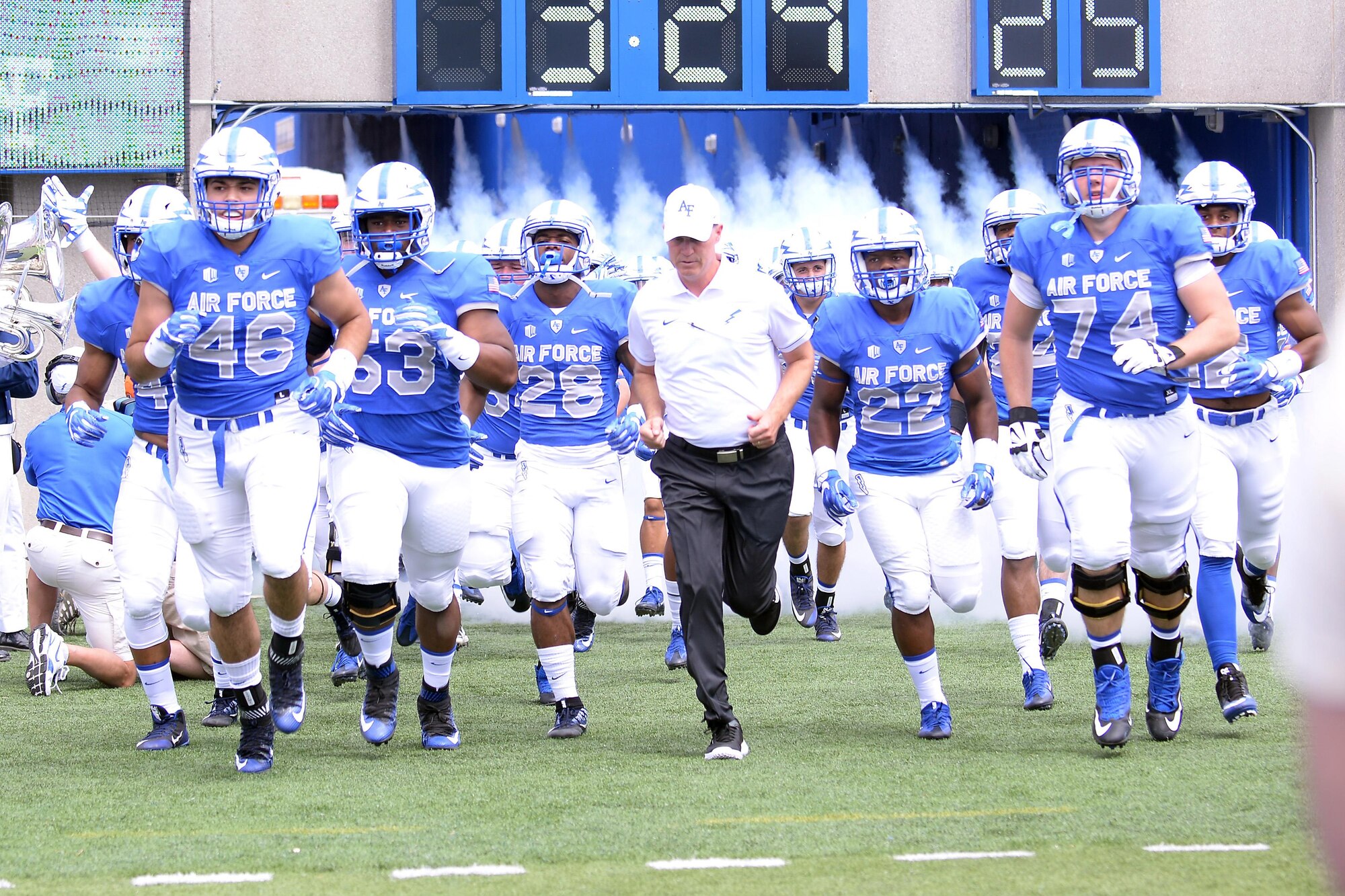 Falcons' head coach Troy Calhoun leads Air Force on to the field at Falcon Stadium, Sept. 3, to take on the Abilene Christian University Wildcats. Air Force beat Abilene 37-21. (U.S. Air Force photo/Darcie Ibidapo) 