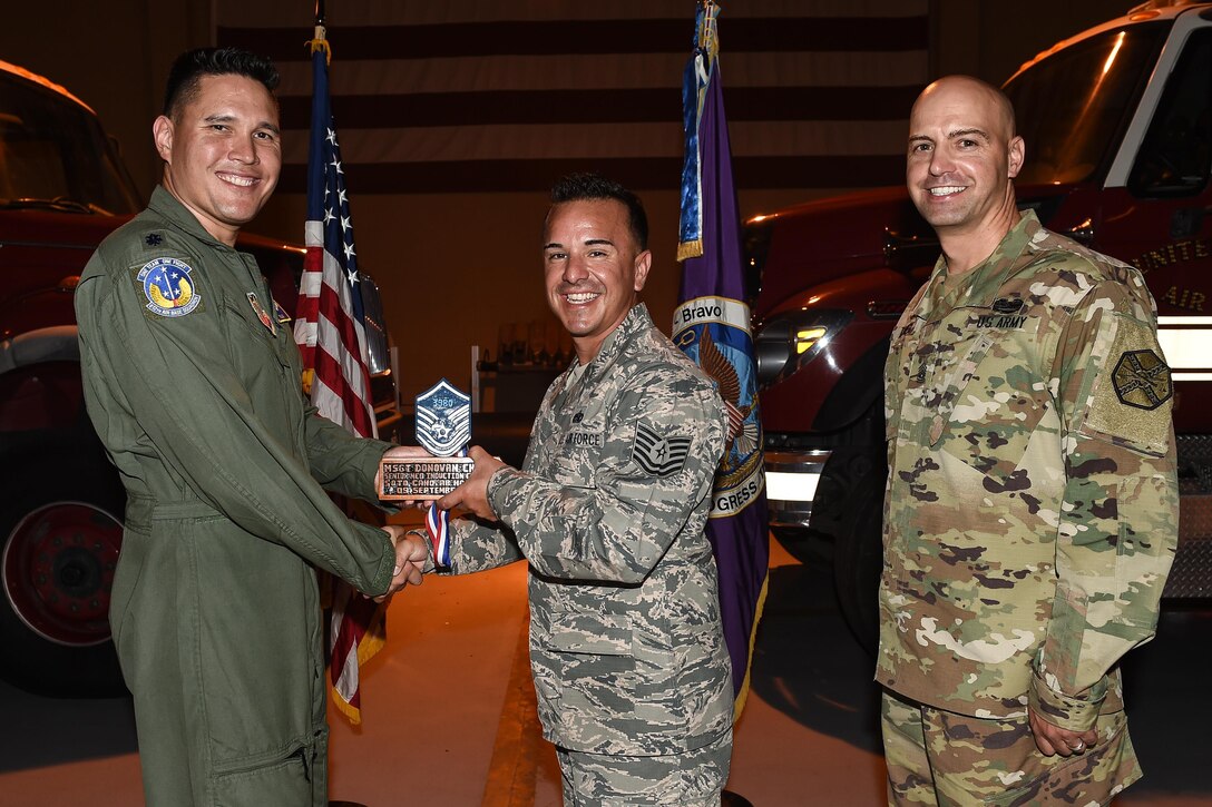 U.S. Air Force Tech. Sgt. Donovan A. Chavez (center), 612th Air Base Squadron radar systems NCO in charge, poses for a photo with Lt. Col. David Aragon, 612th ABS commander, and U.S. Army Cmd. Sgt. Maj. Robin Bolmer, Army Support Activity command sergeant major, during the first senior non-commissioned officer induction ceremony held at Soto Cano Air Base, Honduras, Sept. 9, 2016. Chavez was raised in Barstow, Calif., and entered the Air Force in 2004. 