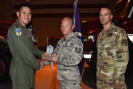 U.S. Air Force Tech. Sgt. Justin M. Williams (center), 612th Air Base Squadron aerospace ground equipment section chief, poses for a photo with Lt. Col. David Aragon, 612th ABS commander, and U.S. Army Cmd. Sgt. Maj. Robin Bolmer, Army Support Activity command sergeant major, during the first senior non-commissioned officer induction ceremony held at Soto Cano Air Base, Honduras, Sept. 9, 2016. Williams was raised in Navarre, Fla., and joined the Air Force in 2002.