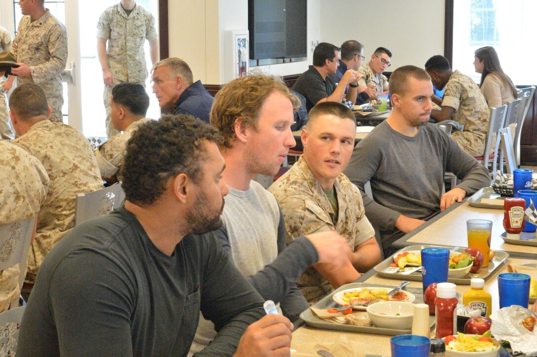 Members of the U.S. National Men's Hockey team dined with Marines at Malachowski Hall during a visit to Marine Corps Base Quantico. NHL players Dustin Byfuglien, Justin Abdelkader and Matt Niskanen converse with Marines in this image.