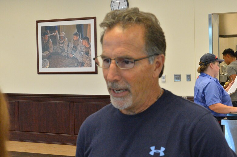 U.S. National Men's Hockey Team Head Coach John Tortorella speaks with Quantico Sentry during lunch at Malachowski Hall during a visit by the team of NHL players during a military appreciation tour of Marine Corps Base Quantico.