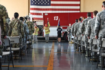 Attendees of the 9/11 remembrance ceremony stand at attention while a special color guard comprised of members of Joint Task Force-Bravo’s Joint Security Forces, Medical Element and Fire Emergency Services post the colors at Soto Cano Air Base, Honduras, Sept. 9, 2016. More than 200 members of JTF-Bravo attended the ceremony held to honor the 447 emergency services personnel who lost their lives during the terrorist attacks of Sept. 11, 2001.