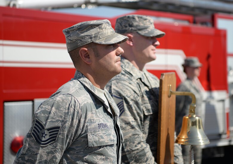 Tech. Sgt. Daniel Bernal, 9th Civil Engineer Squadron battalion chief, stands waiting to ring a bell Sept. 9, 2016, at Beale Air Force Base, California. The bell is rung three times during the ceremony to honor the fallen. (U.S Air Force photo/ Tristan D. Viglianco)