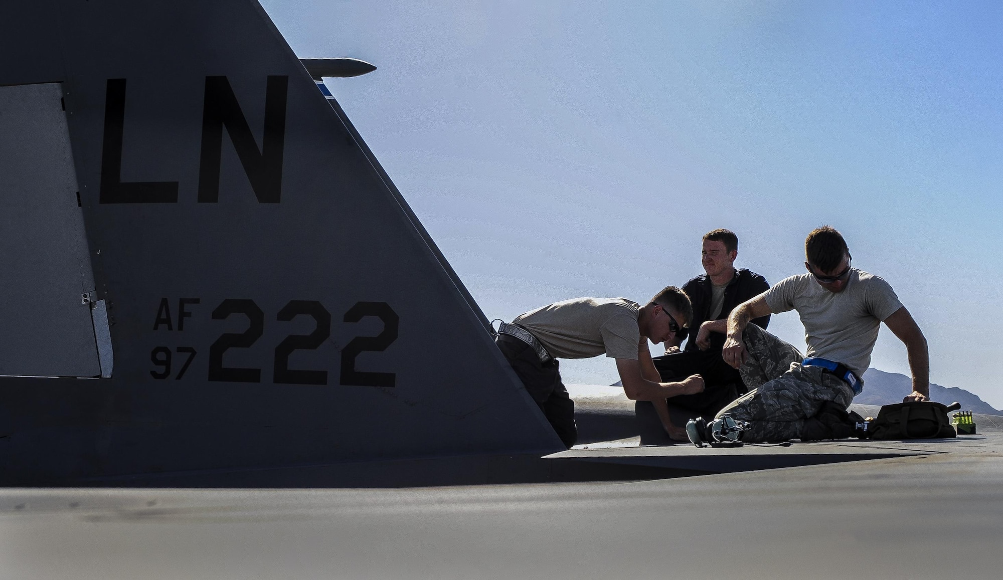 Maintainers with the 48th Aircraft Maintenance Squadron, Royal Air Force Lakenheath, England, make repairs to an F-15E Strike Eagle that participated in Green Flag 16-09 at Nellis Air Force Base, Nev., Sept. 9, 2016. The exercise provides invaluable combat training to joint and coalition warfighters in the art of air-land integration and the joint employment of airpower. (U.S. Air Force photo by Airman 1st Class Kevin Tanenbaum/Released)