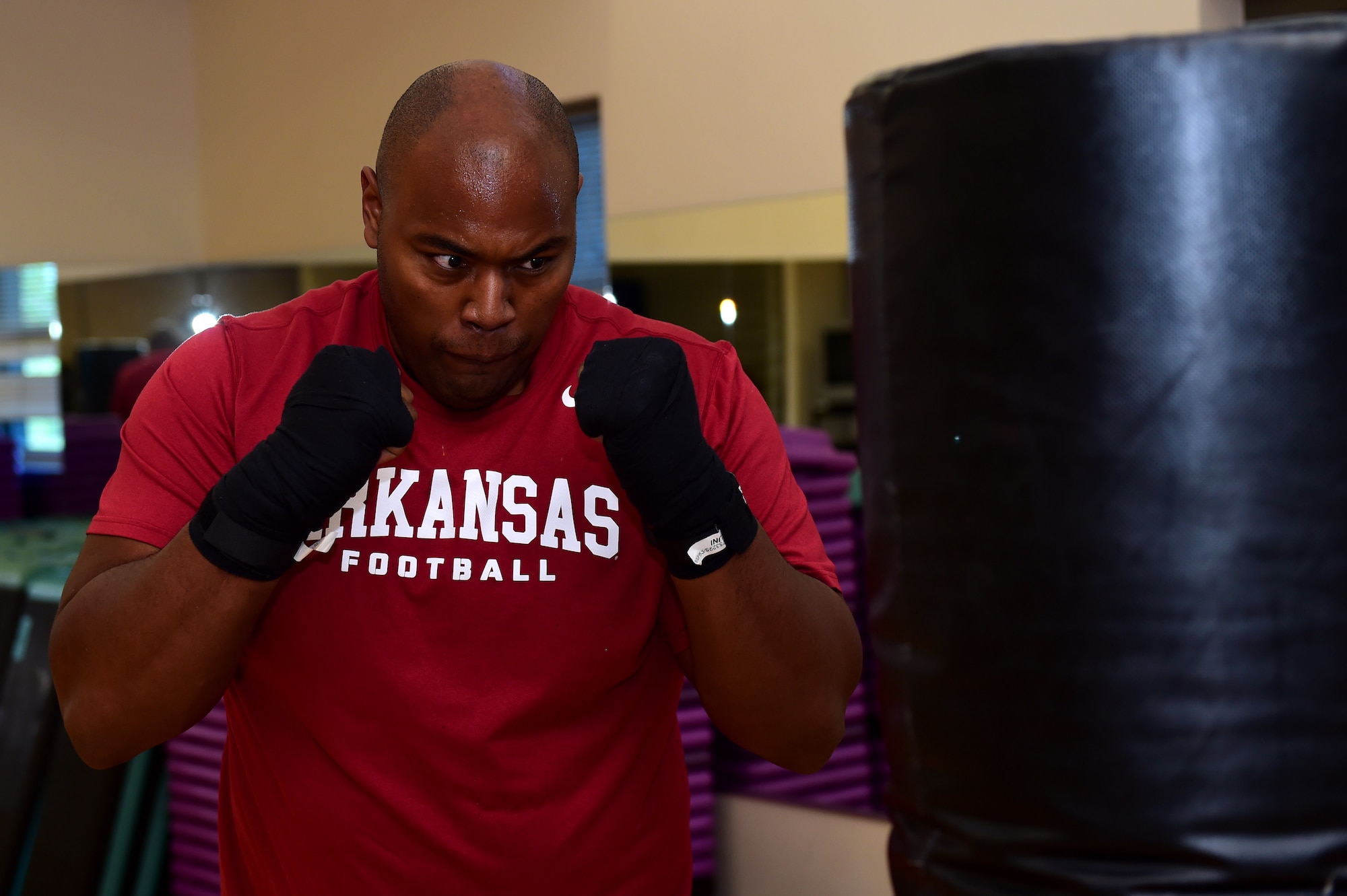 U.S. Army Sgt. Anthony Lee, 743D Military Intelligence Battalion network infrastructure manager, spars with a punching bag Sept. 9, 2016, at the Buckley Fitness Center on Buckley Air Force Base, Colo. The fitness center provides service members, retirees and dependents with different options to stay healthy and fit to fight. (U.S. Air Force photo by Airman 1st Class Gabrielle Spradling/Released)