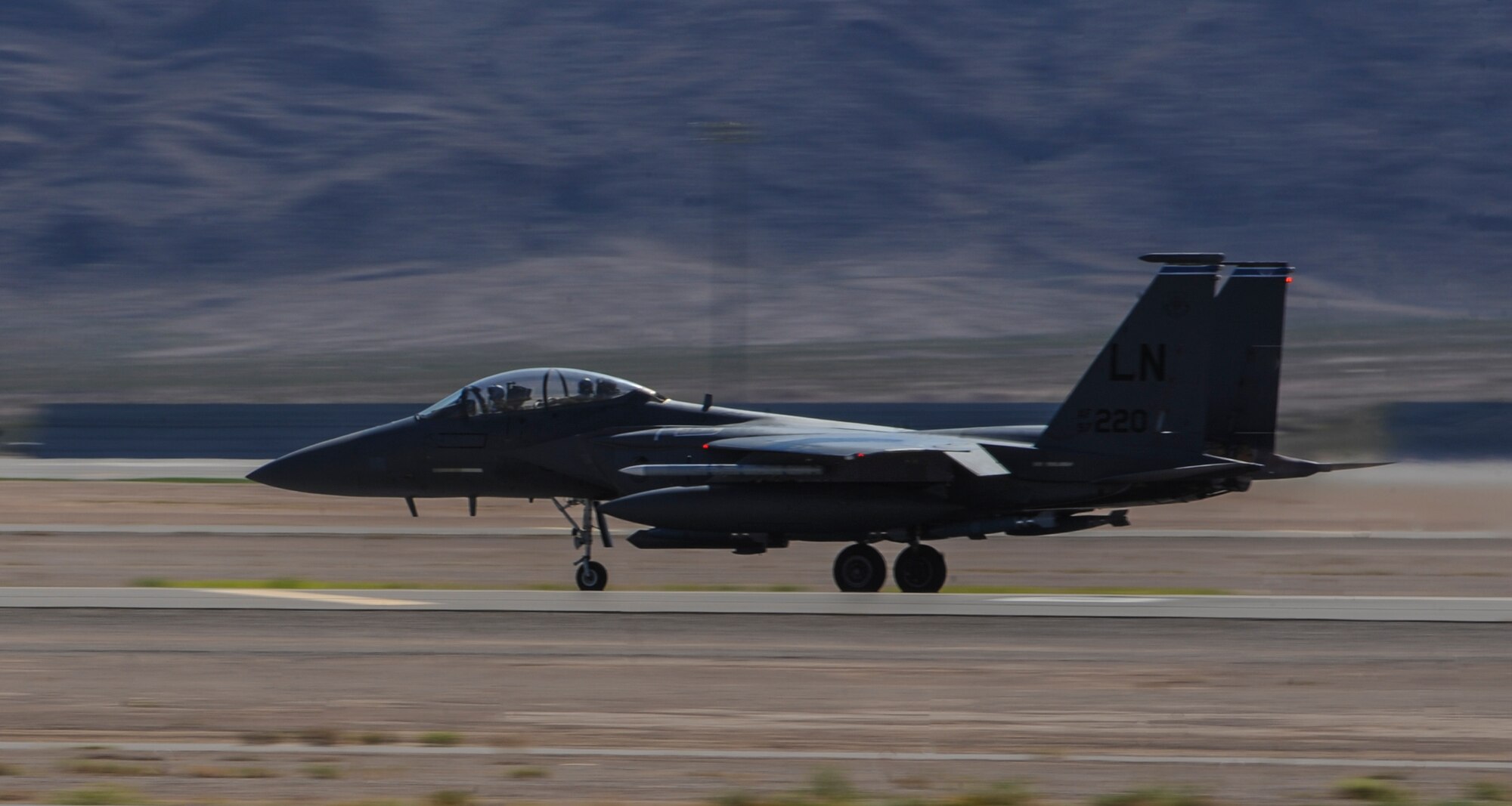 An F-15E Strike Eagle assigned to 492nd Fighter Squadron, Royal Air Force Lakenheath, England, jets down the runway during takeoff to participate in Green Flag 16-09 at Nellis Air Force Base, Nev., Sept. 9, 2016. Green Flag 16-09 will be the last Green Flag exercise to take place during the 2016 fiscal year at Nellis AFB. (U.S. Air Force photo by Airman 1st Class Kevin Tanenbaum/Released)