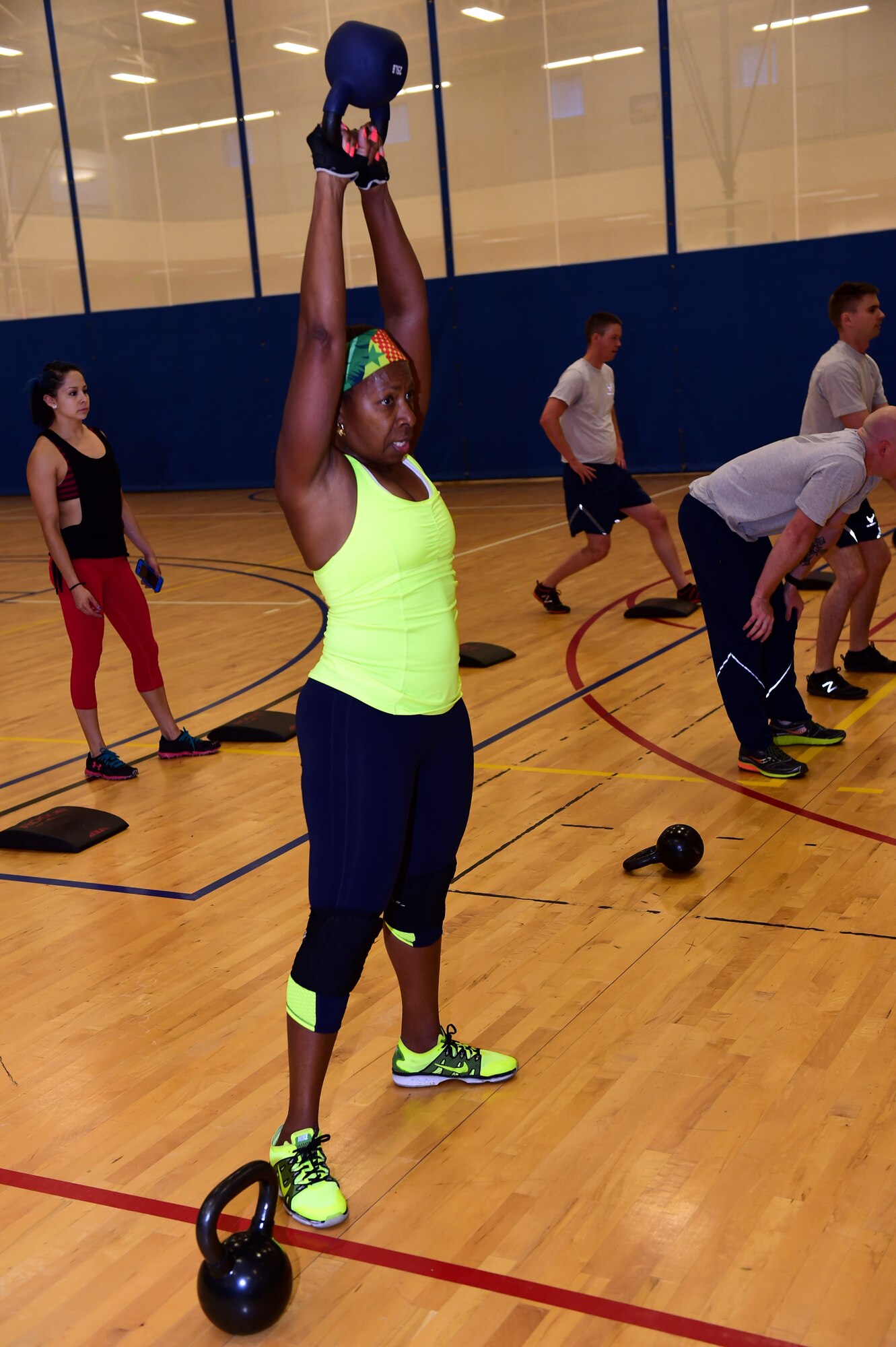 Sandra Stevens, retired military member spouse,  swings a kettlebell Sept. 9, 2016, at the Buckley Fitness Center on Buckley Air Force Base, Colo. The fitness center provides service members, retirees and dependents with different options to stay healthy and fit to fight. (U.S. Air Force photo by Airman 1st Class Gabrielle Spradling/Released)