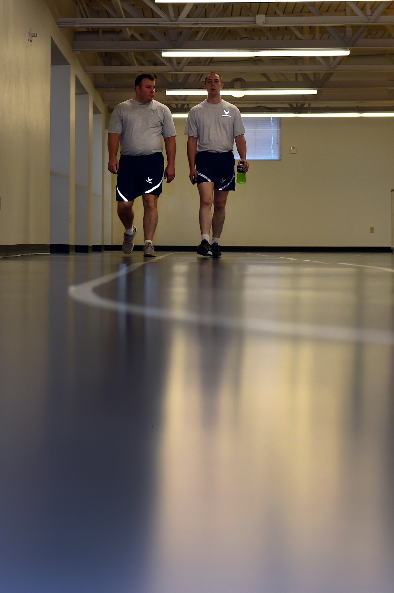 Team Buckley members walk the indoor track Sept. 9, 2016, at the Buckley Fitness Center on Buckley Air Force Base, Colo. The fitness center is available 24/7 for active duty, guardsmen, reservists and their dependents 18 years and older; however, individuals must have at least one authorized or registered workout partner with them in the facility during after-hour use. (U.S. Air Force photo by Airman 1st Class Gabrielle Spradling/Released)