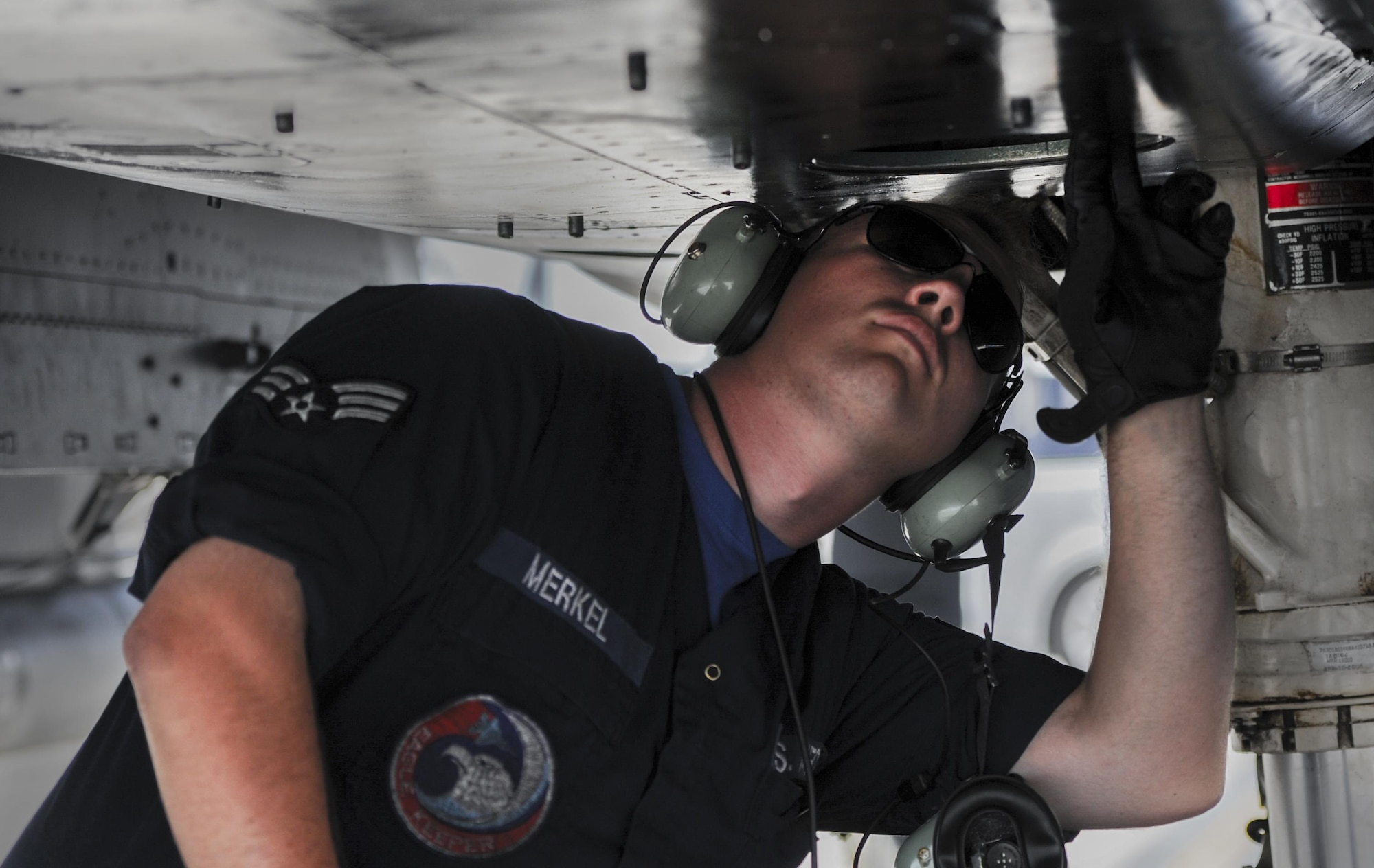 Senior Airman Travus Merkel, 48th Aircraft Maintenance Squadron crew chief, Royal Air Force Lakenheath, England, performs final checks on an F-15E Strike Eagle before takeoff at Nellis Air Force Base, Nev., Sept. 9, 2016. Green Flag, in support of the U.S. Army's National Training Center, provides invaluable combat training to joint and coalition warfighters in the art of air-to-surface integration and the joint employment of airpower. (U.S. Air Force photo by Airman 1st Class Kevin Tanenbaum/Released)