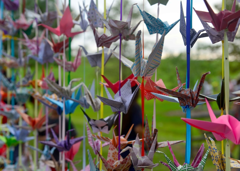 The 1,000 crane curtain hangs during the Out of the Darkness Community Walk at Mount Trashmore Park, Virginia Beach, Va., Sept. 10, 2016. The crane was chosen to represent the Out of the Darkness Community Walk as it, over the centuries, has become a symbol of healing, happiness and hope. In Japan people believed this ancient bird lived for a 1,000 years. Legend has it that, if you fold 1000 paper cranes, your prayers will be answered. Volunteers of the Walk have folded this many with our prayers for peace, not only for those who presently suffer from depression but also for those who have died by suicide. (U.S. Air Force photo by Tech. Sgt. Daylena S. Ricks)