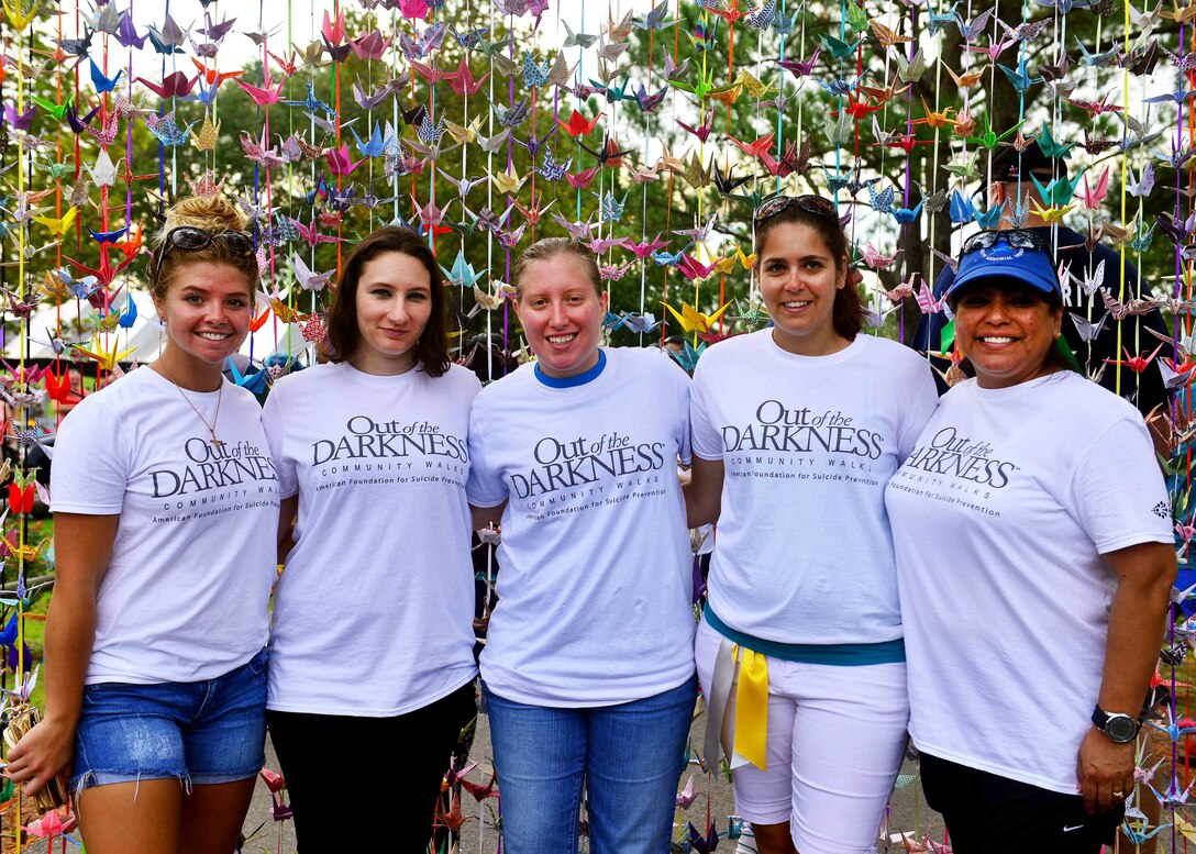 Volunteers pose for a group photo during the Out of the Darkness Community Walk at Mount Trashmore Park, Virginia Beach, Va., Sept. 10, 2016.  Three hundred volunteers helped put on the event. (U.S. Air Force photo by Tech. Sgt. Daylena S. Ricks)