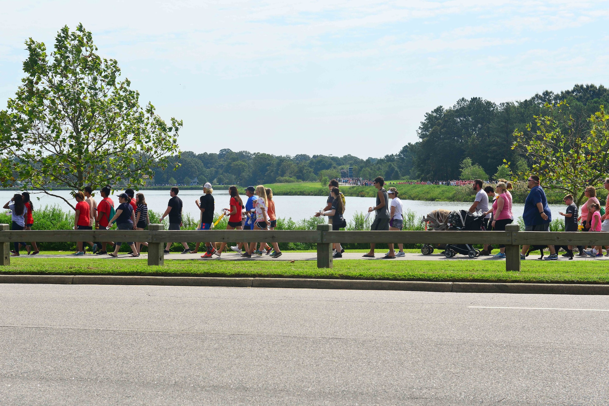 Participants walk during the Out of the Darkness Community Walk at Mount Trashmore Park, Virginia Beach, Va., Sept. 10, 2016. Families walked 4,097 steps to celebrate, honor and remember victims of suicide. (U.S. Air Force photo by Tech. Sgt. Daylena S. Ricks)