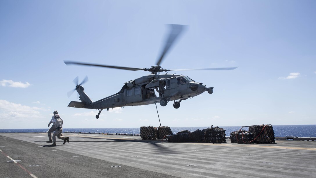Marines assigned to the 22nd Marine Expeditionary Unit and Sailors assigned to the amphibious assault ship USS Wasp transfer cargo from Wasp to the fleet replenishment oiler USNS Big Horn, Sept 9, 2016. 22nd MEU, deployed with the Wasp Amphibious Ready Group, is conducting naval operations in the 6th Fleet area of operations in support of U.S. national security interests in Europe and Africa.