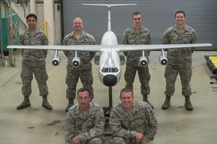 (From left to right) Airman 1st Class Drew Maifeaphomsamouth, 437th Maintenance Squadron corrosion control specialist, Tech. Sgt. Andrew Finley, 437th MXS corrosion control non-commissioned officer in charge, 437th MXS corrosion control specialists Airman 1st Class Michael Mooney, Airman 1st Class Shawn Casey, Airman Riley Carter and Senior Airman William Treiber gather around a C-141B Starlifter model on Joint Base Charleston, South Carolina, Sept. 7, 2016. They voluntarily renovated the model aircraft from June to August 2016 and dedicated it to the crew of a C-141 that crashed in 1982.