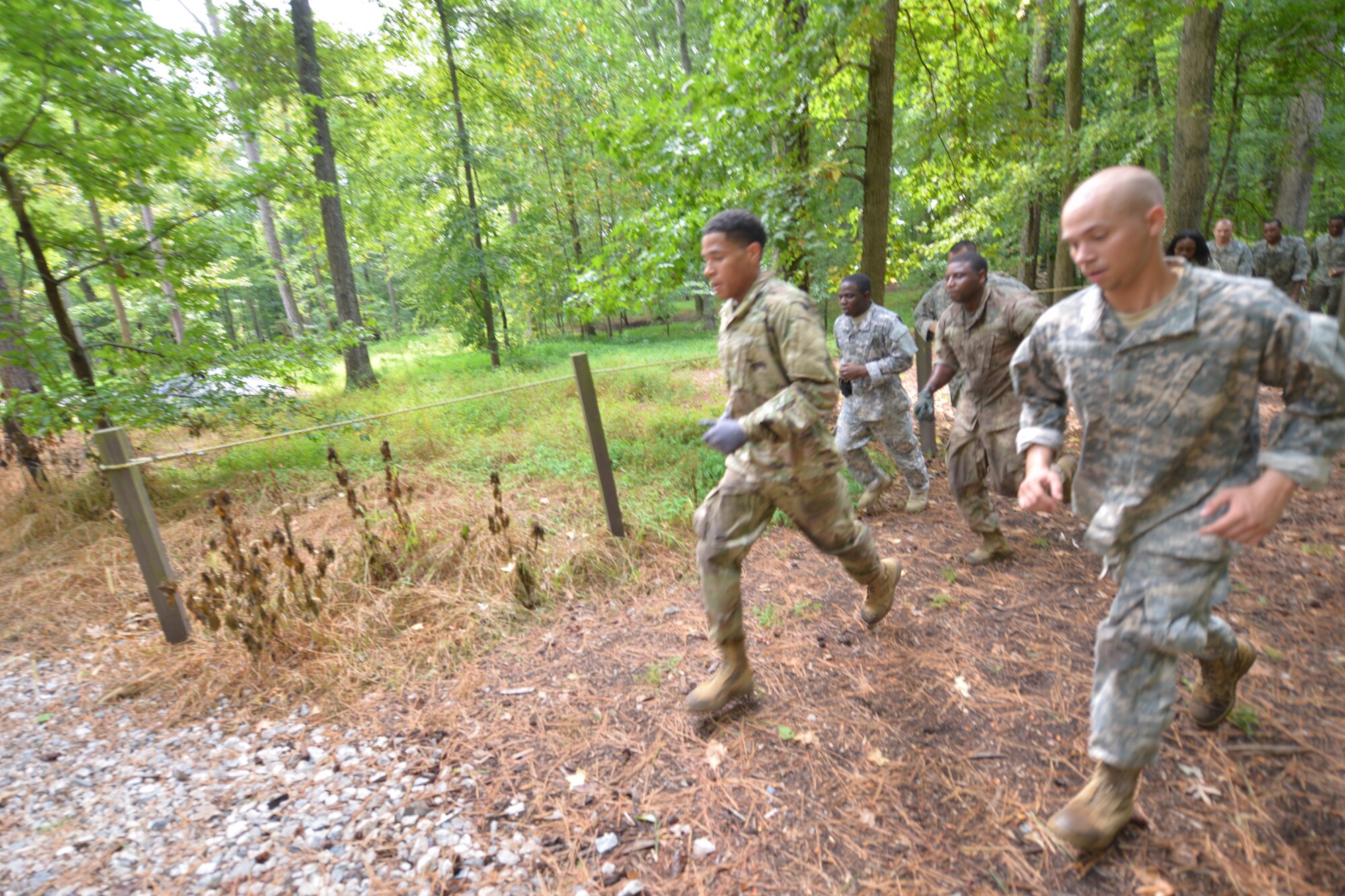 Members of 1st Platoon, 155th Inland Cargo Transport Company, run to the finish line of the obstacle course at Joint Base Langley-Eustis, Va., Sept. 8, 2016. The first platoon won the competition beating out the four other platoons in the company. (U.S. Air Force photo by Staff Sgt. Natasha Stannard)