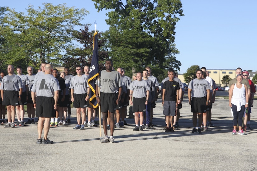 Civilians and soldiers stand together after the 9/11 Remembrance 5K Run, September 11, 2016 in Fort Sheridan.  Runners received a participation medal and t-shirt.