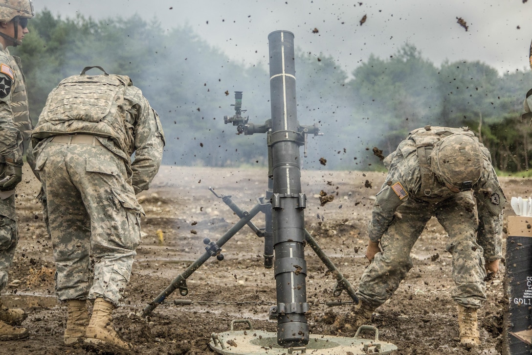 Soldiers fire an M120 mortar system as part of the Orient Shield 2016 exercise at Aibano Training Area near Shiga, Japan, Sept. 13, 2016. Army photo by Spc. Patrick Kirby