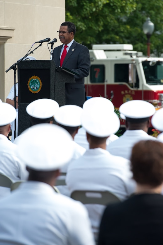 McKinley Price, Newport News Mayor, speaks during a 9/11 memorial ceremony at the Victory Arch in Newport News, Va., Sept. 11, 2016. Price asked those in attendance to remember how Americans "came together as one in support of this country," adding that the importance of togetherness is still prevalent today. (U.S. Air Force photo by Staff Sgt. J.D. Strong II)