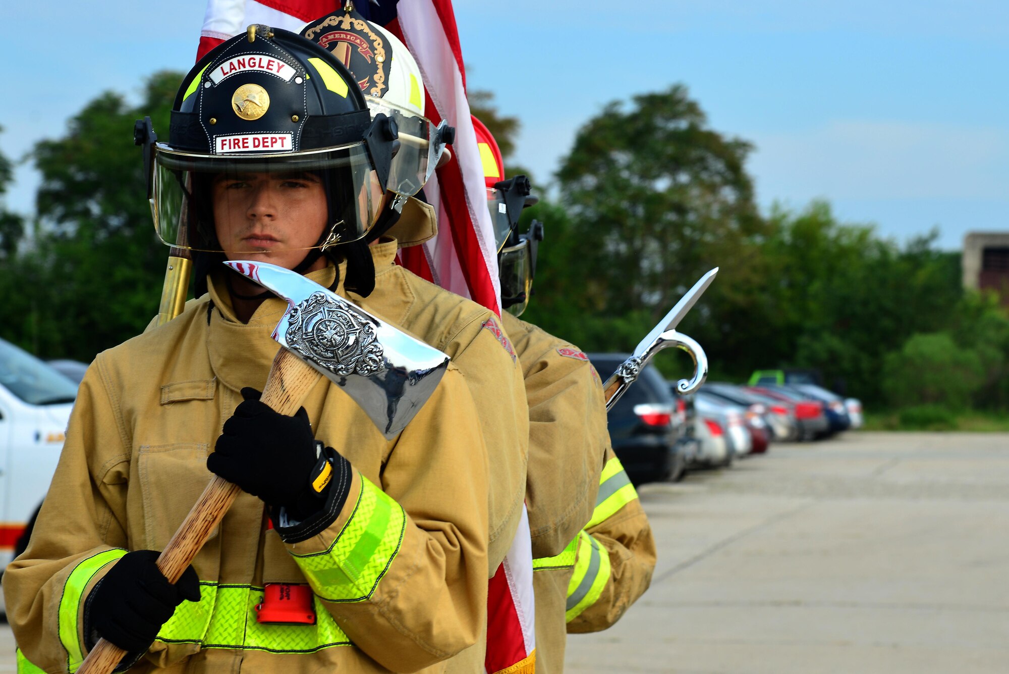 Firefighters from the 733rd Civil Engineer Division perform a detail in honor of the 9/11 ceremony at Joint Base Langley-Eustis, Va., Sept. 9, 2016. The ceremony was held to honor those whom lost their lives during the tragic event that happened on Sept. 11, 2001. (U.S. Air Force photo by Airman 1st Class Tristan Biese)