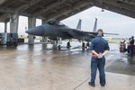 Airman 1st Class Dennis Hatcher, 18th Aircraft Maintenance Squadron crew chief, prepares to guide an F-15 Eagle Sept. 9, 2016, at Kadena Air Base, Japan. F-15 Eagles departed from Kadena in support of Exercise Valiant Shield. Valiant Shield is a joint exercise between the U.S. armed forces which focuses on maintaining land, air, sea and cyberspace dominance in the Pacific.