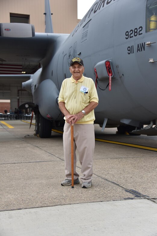 Guy Prestia, 94, stands in front of a C-130 Hercules for a photo at a Veterans Breakfast Club event at the 911th International Airport Air Reserve Station, Pa., Sept. 9, 2016. Prestia was drafted in the Army in 1942 as an infantryman with the 45th Infantry Division. (U.S. Air Force photo by Airman 1st Class Bethany Kobily)