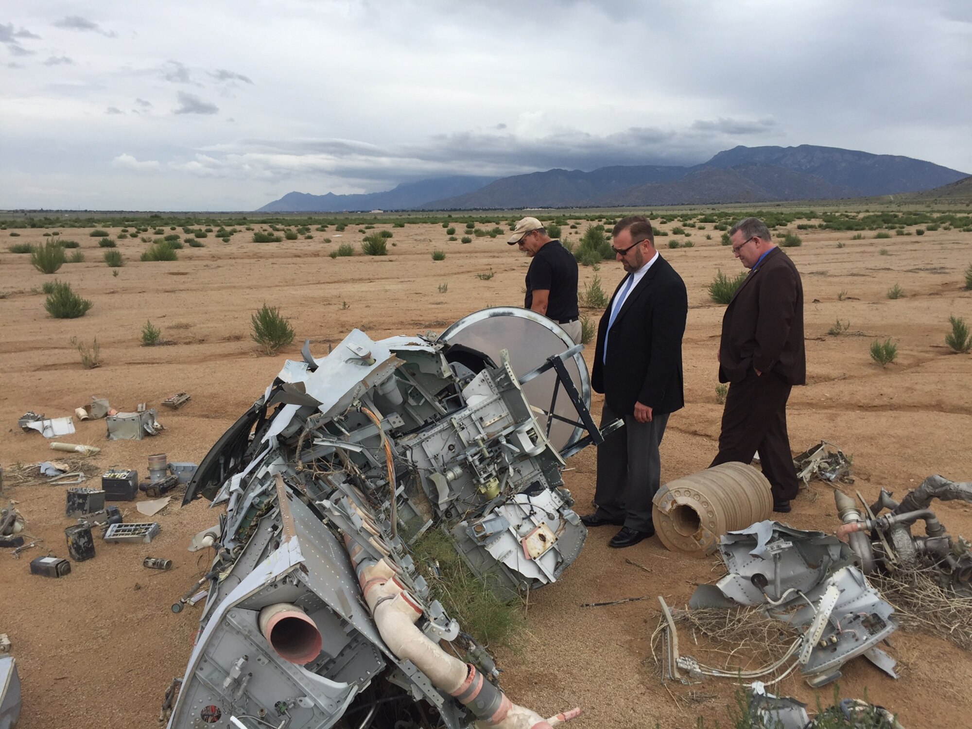 Representatives of the American Society of Safety Engineers visited the Air Force Safety Center, Kirtland Air Force Base, N.M., on Sept 7, 2016, to discuss current and future ways to collaborate on national consensus standards that affect the Air Force, and training and development of safety professionals. Chris Herrmann, aviation safety instructor, center, leads Tom Kerschner, ASSE account executive, left, and Tim Fisher, ASSE director of standards and technical services, right, on a tour of the Air Force Safety Center’s Crash Lab.