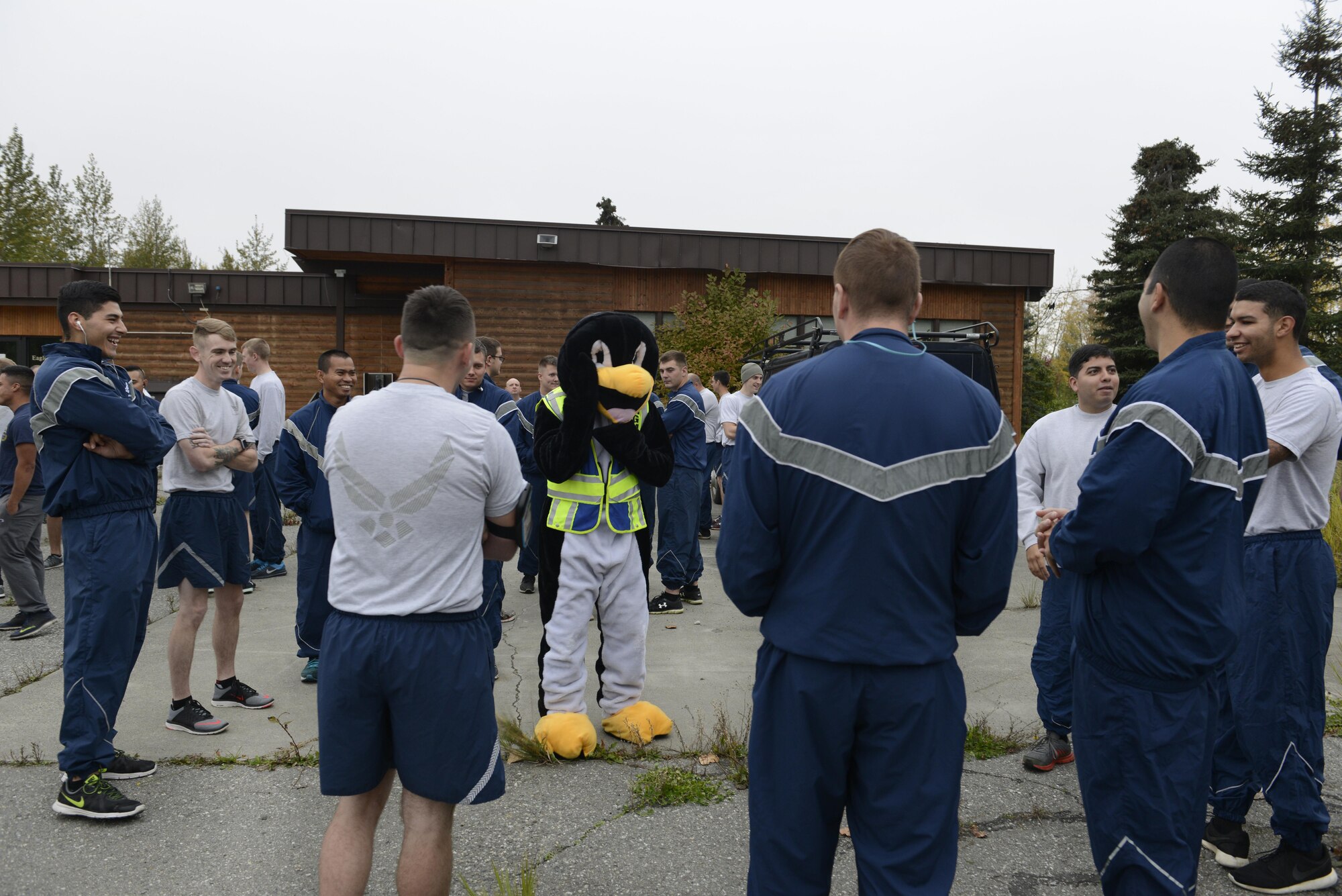 Perry the Preparedness Penguin greets Airmen before the start of the Run to be Ready 5K at the Eagleglen Fitness Park at Joint Base Elmendorf-Richardson, Alaska, Sept. 9, 2016. The event was hosted to raise awareness for National Preparedness Month and emergency kits were given as prizes to the top male and female finishers. 
