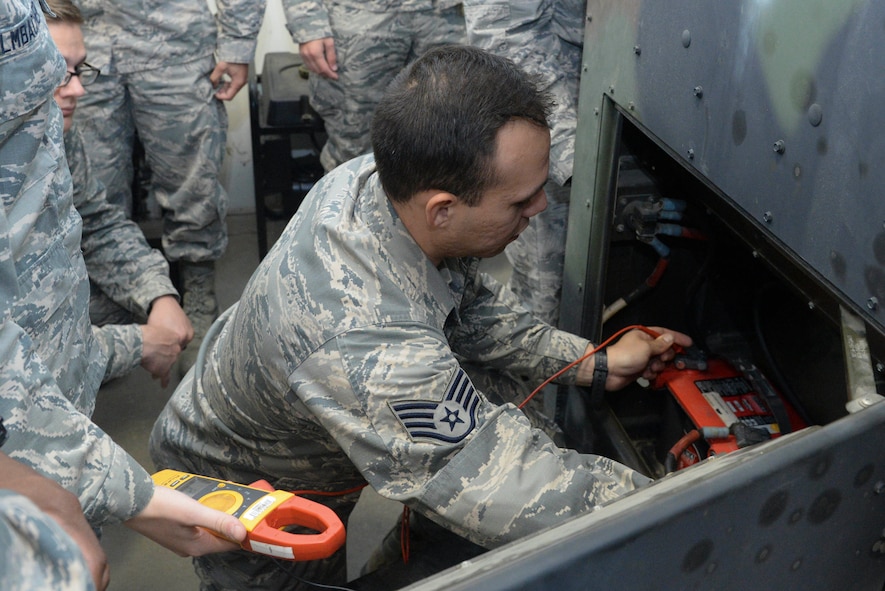 An Airman from the 5th Civil Engineer Squadron electrical power production shop checks the battery level of a generator at Minot Air Force Base, N.D., Sept. 12, 2016. Pre-operation inspections are conducted monthly to ensure the generators are working properly. (U.S. Air Force photo/Airman 1st Class Jessica Weissman)