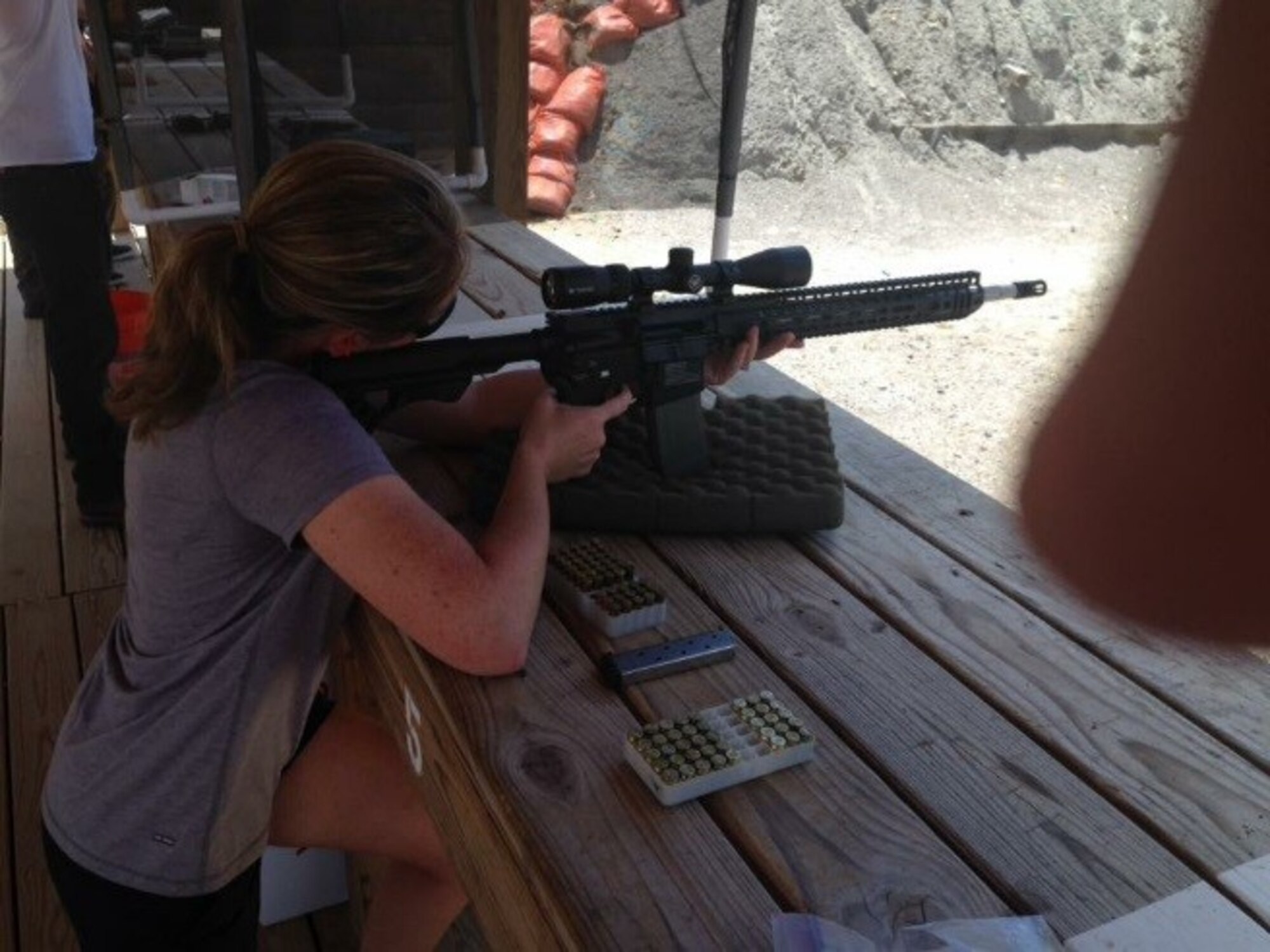 U.S. Air Force Master Sergeant Christina George, 480th Intelligence, Surveillance and Reconnaissance Group master resiliency trainer, tries the shooting range during the Comprehensive Airmen fitness program, at Fort Gordon, Ga, July 27, 2016. Six volunteers from the community, who were all certified and experts, led her through a guided range. (U.S. Air Force/courtesy photo)