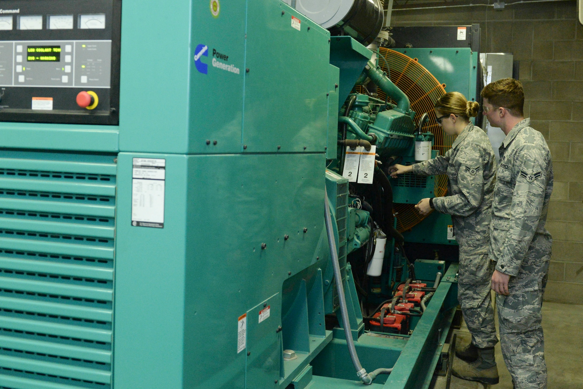 Electrical power production apprentices from the 5th Civil Engineer Squadron conduct a pre-operation inspection on a generator at Minot Air Force Base, N.D., Sept. 12, 2016. Generators around base are inspected and run monthly to ensure they are working properly. (U.S. Air Force photo/Airman 1st Class Jessica Weissman)