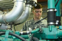Airman 1st Class Jacob Lang, an electrical power production apprentice assigned to the 5th Civil Engineer Squadron, checks over a generator at Minot Air Force Base, N.D., Sept. 12, 2016. Generators are the backup power source for mission essential buldings on base. (U.S. Air Force photo/Airman 1st Class Jessica Weissman)