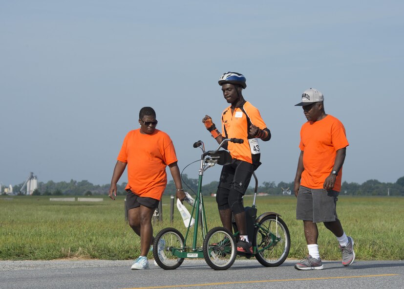 Corey Bryan, Upper Shore athlete, takes a warm-up lap on his stand-up bicycle prior to the start of the Special Olympics Delaware 2016 Cycling Classic Sept. 10, 2016, at Dover Air Force Base, Del. SODE and Dover AFB have had an ongoing relationship since 1993. (U.S. Air Force photo by Senior Airman Zachary Cacicia)
