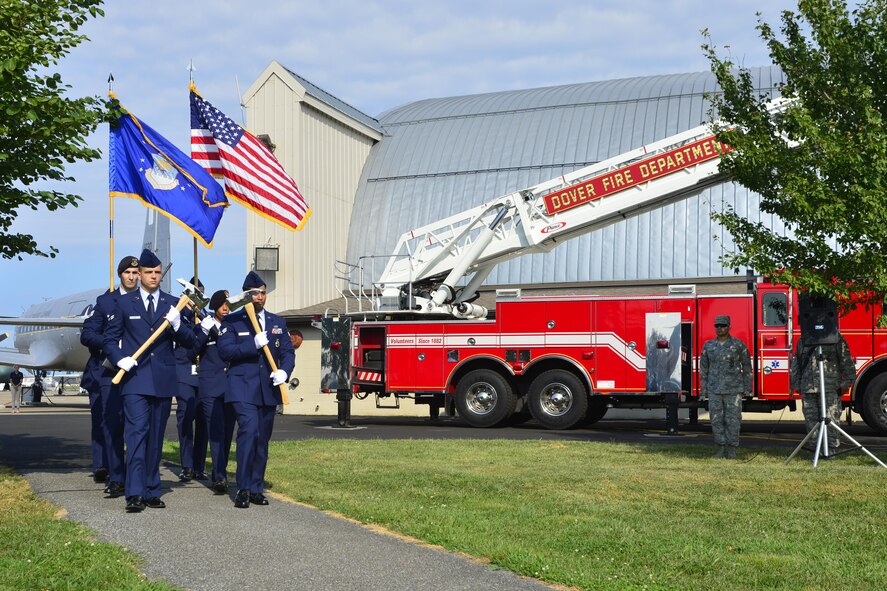 Members from the Dover Air Force Base Honor Guard, 436th Security Forces Squadron and firefighters from the 436th Civil Engineer Squadron march during the 15th Anniversary 9/11 Memorial Service Sept. 11, 2016, at the Air Mobility Command Museum on Dover AFB, Del. The 9/11 Memorial at the museum includes two pieces of steel from the World Trade Center, a rock from the United Airlines Flight 93 crash site and a block from the damaged portion of the Pentagon. (U.S. Air Force photo by Senior Airman William Johnson)