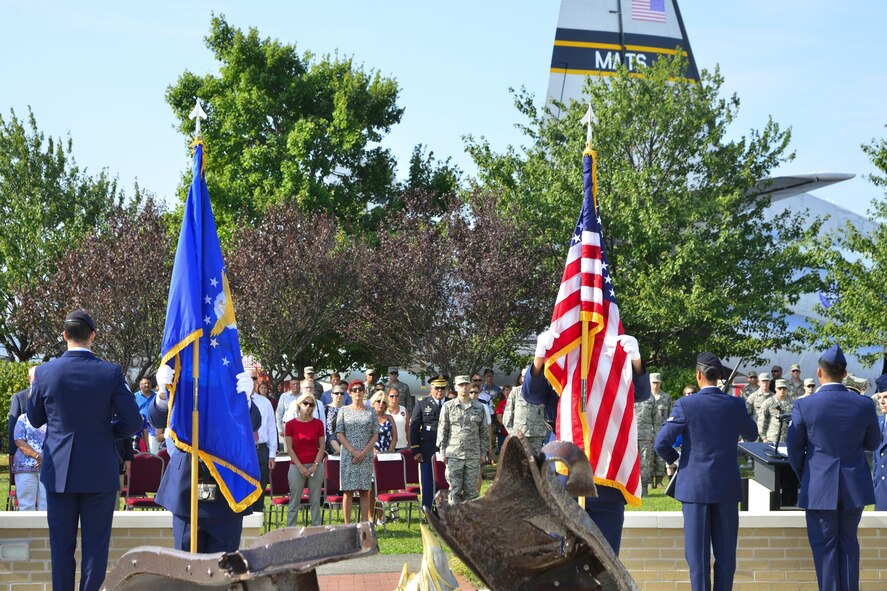 Members of the Dover Air Force Base Honor Guard dress the flags during the beginning of the 15th Anniversary 9/11 Memorial Service Sept. 11, 2016, at the Air Mobility Command Museum on Dover AFB, Del. Members of the 436th Security Forces Squadron and firefighters from the 436th Civil Engineer Squadron stood guard of the memorial during the playing of the national anthem and presentation of the colors. (U.S. Air Force by Senior Airman William Johnson)