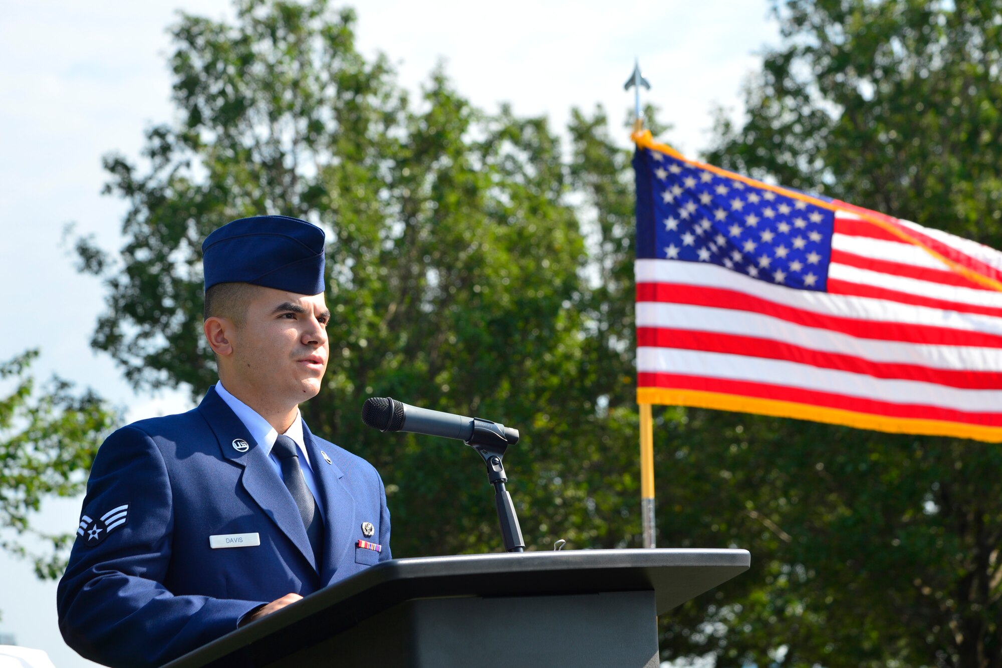 Senior Airman Shawn Davis, 436th Civil Engineer Squadron firefighter, speaks at the 15th Anniversary 9/11 Memorial Service Sept. 11, 2016, at the Air Mobility Command Museum on Dover Air Force Base, Del. Davis spoke about his memories of the terror attacks and how it influenced his career choices to become a firefighter. (U.S. Air Force photo by Senior Airman William Johnson)