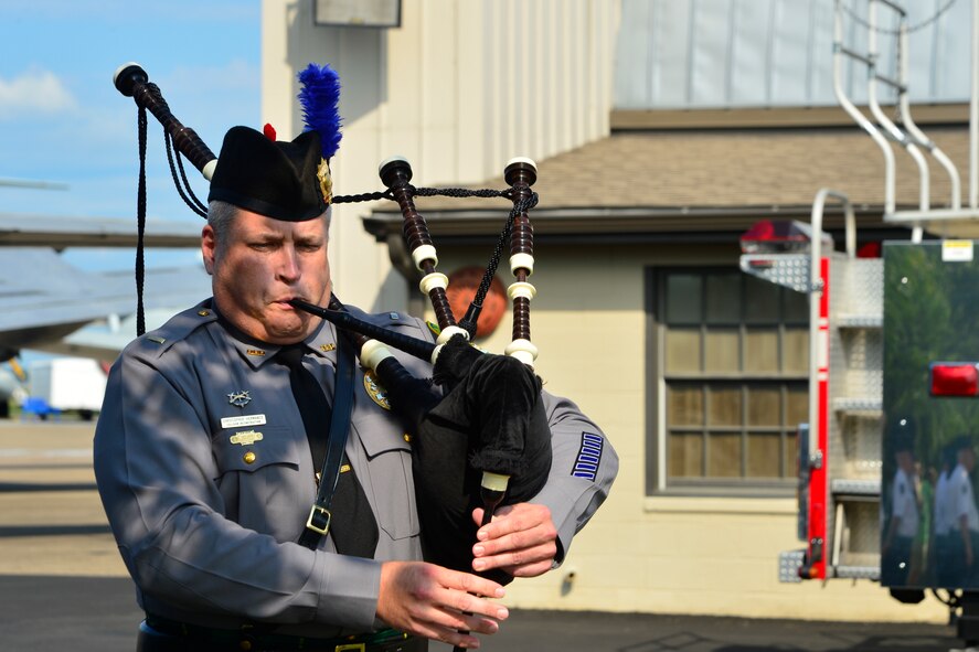 Chris Hemarance, Dover Policeand Fire Pipes & Drums pipes major, plays Amazing Grace during the 15th Anniversary 9/11 Memorial Service Sept. 11, 2016, at the Air Mobility Command Museum on Dover Air Force Base, Del. Members of The Dover Police and Fire Pipes & Drums are all volunteers and participate in various community, civic and military functions to honor retired and active police officers, firefighters and those who have lost their lives in the line of duty. (U.S. Air Force photo by Senior Airman William Johnson)
