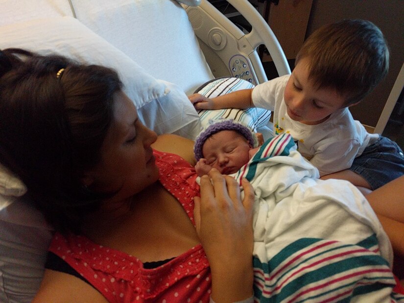 Shalina Shaw holds her newborn daughter Clara at the hospital after giving birth in her home in Yorktown, Va., Aug., 9, 2016. Shalina’s husband, U.S. Air Force Master Sgt. Travis Shaw, Air Combat Command pararescue specialist, relied on his medical training to help deliver Clara. (Courtesy photo)