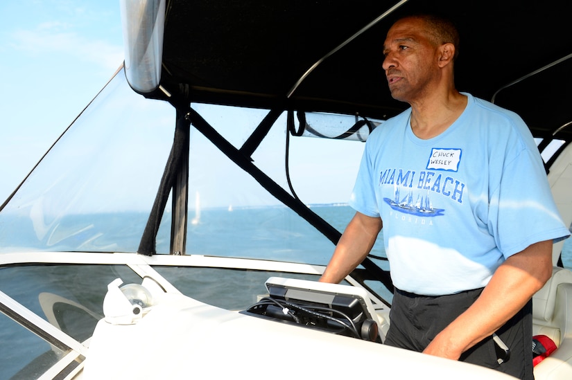 Retired U.S. Air Force Lt. Col. Chuck Wesley, Langley Yacht Club race committee signal boat captain, positions the boat for the start of the Tri-Services Regatta on Chesapeake Bay, Va., Sept. 11, 2016. Every year each military-affiliated yacht club gets the chance to organize the race and the U.S. Air Force-orientated yacht club planned the event for this year. (U.S. Air Force photo by Airman 1st Class Kaylee Dubois)